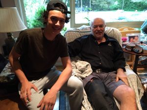 Recognizing a neighbor in need, two man sitting and smiling at the camera